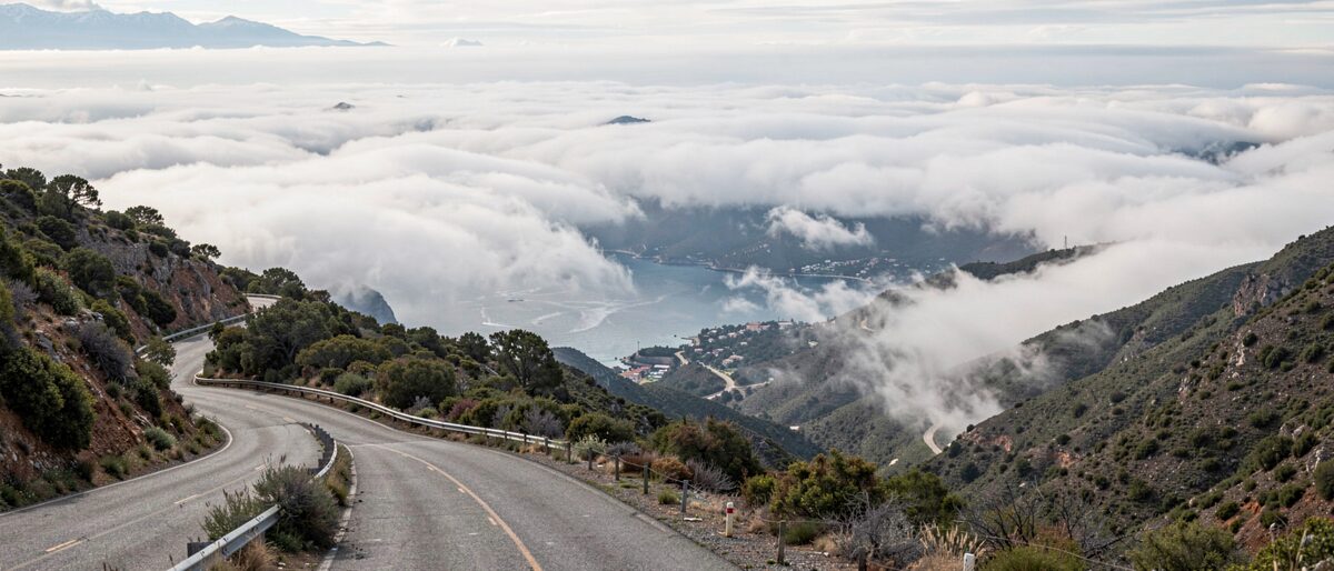 Twelve miles from the shore to the gate below the East Peak: fog, then ridge, then the simplest finish line a race can have.